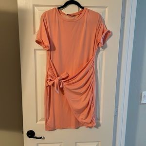 Lillusory pink, short wrap dress.